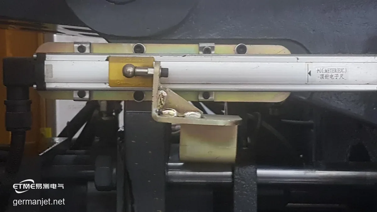 Ejector sensor installation showing slider position relative to the black travel mark